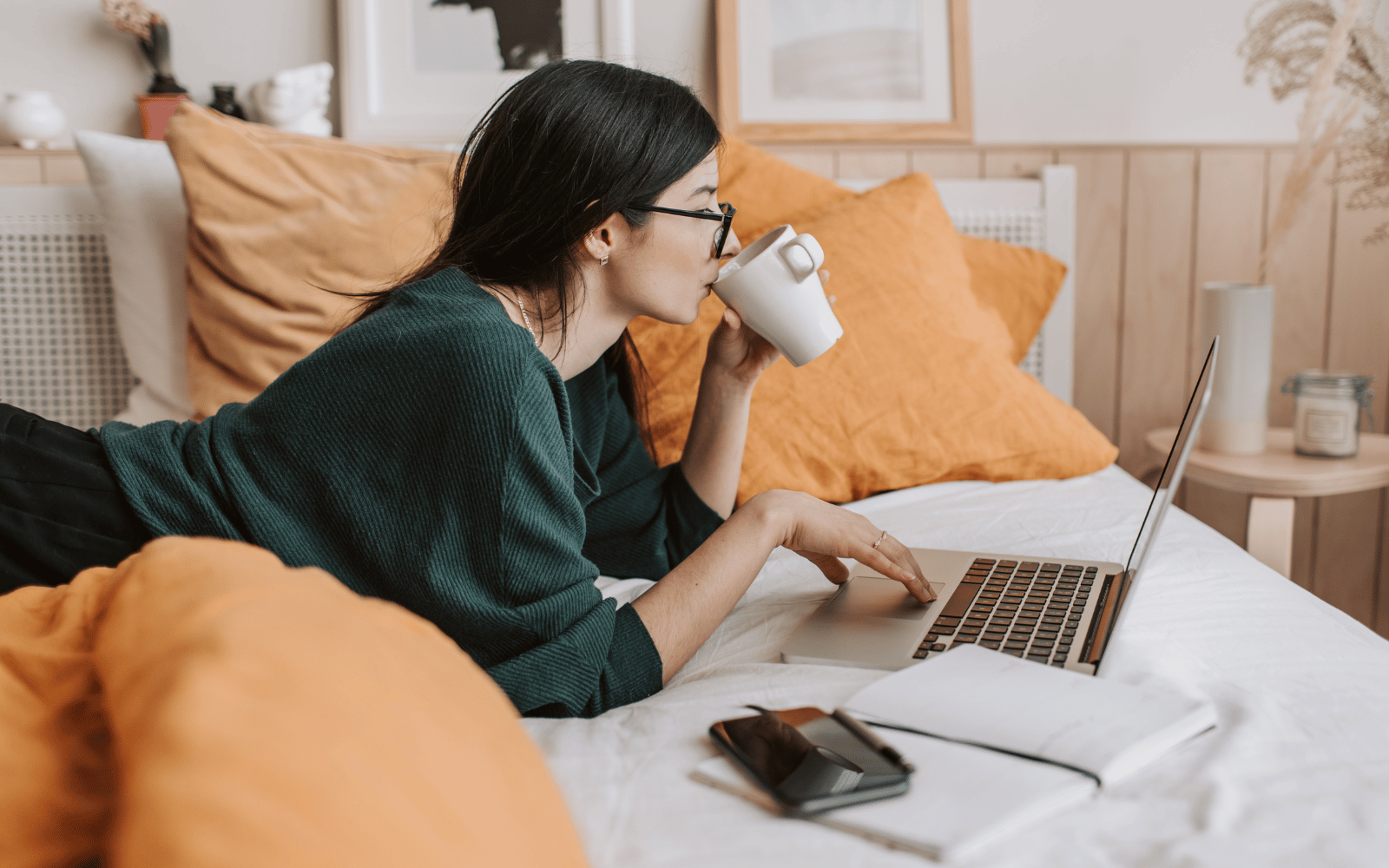 Potential client for a Dietitian Private Practice booking an appointment from home on laptop with coffee